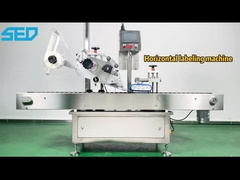 Máy dán nhãn chai tròn theo chiều ngang tự động